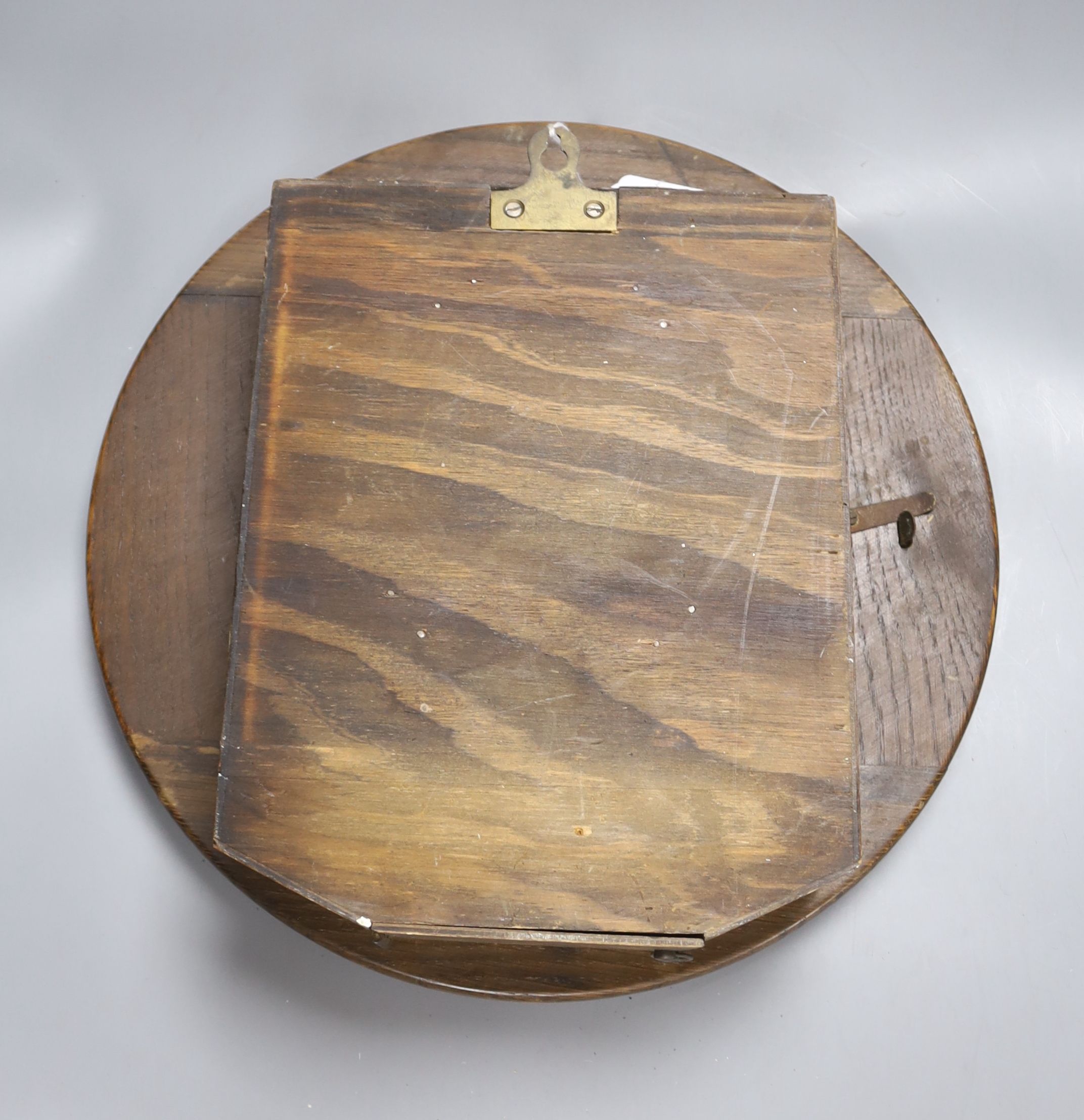 An oak cased wall clock, with black Arabic numerals, by Enfield, diameter 39cm